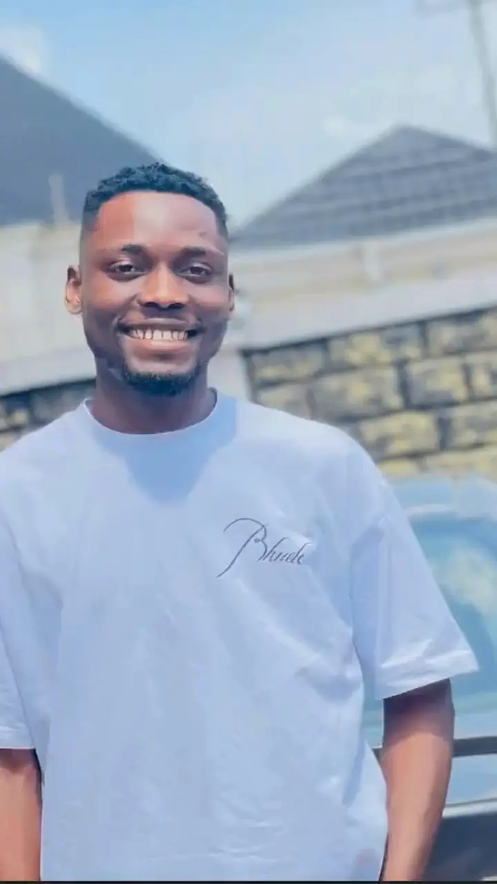 Ifechi Japhet Nwaorisa smiling in front of a house in Owerri, Nigeria