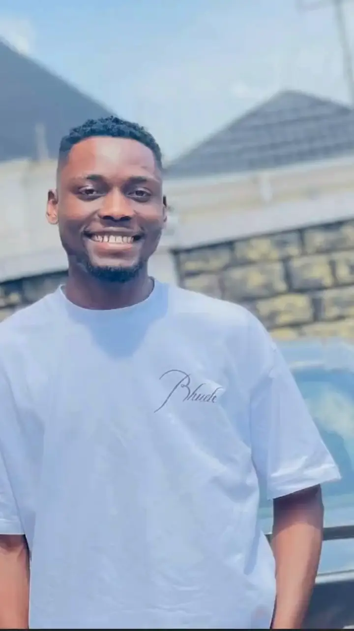 Ifechi Japhet Nwaorisa smiling in front of a house in Owerri, Nigeria